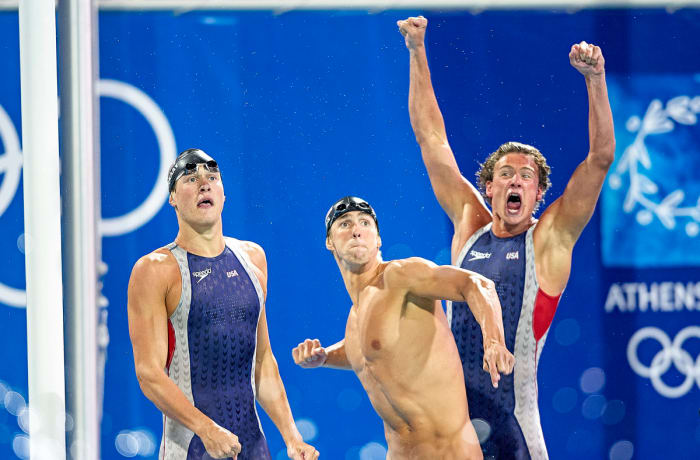 Phelps (center) and Lochte have clashing personalities, but have grown closer as Lochte chases redemption.